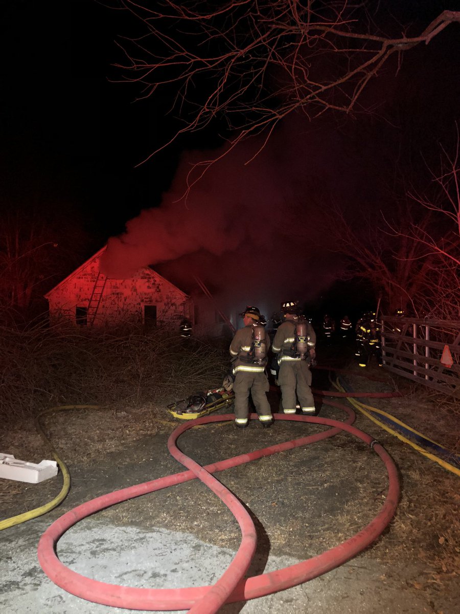Firefighters appeared to have stepped back for a moment as smoke grows inside the building