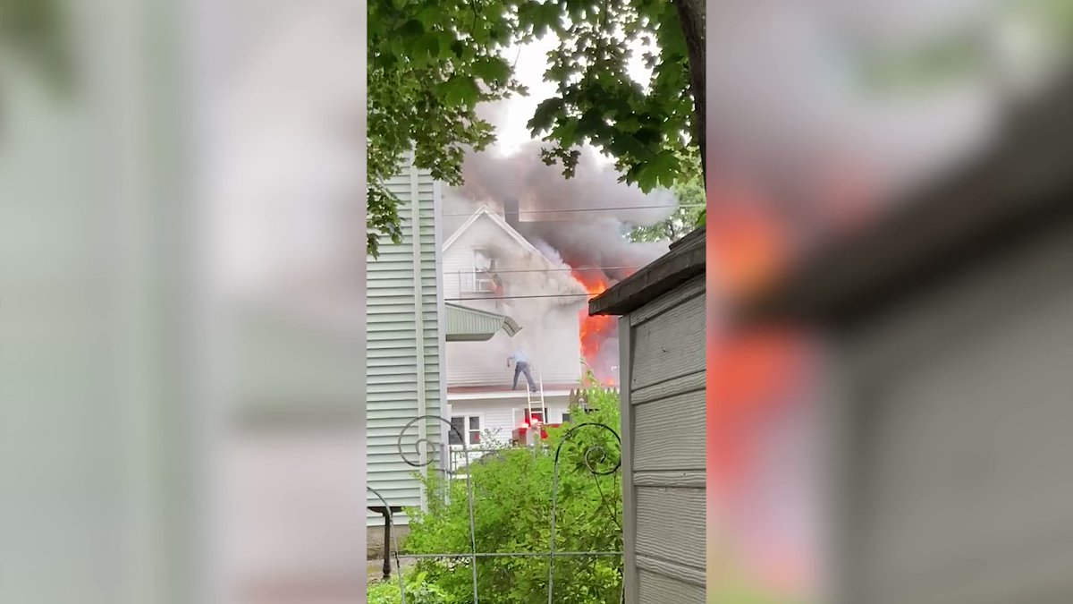 Video shared with @ABC6 shows firefighters rescuing two boys trapped inside of a burning home in Pawtucket yesterday. @Pawtucketpolice say the boys' grandmother who was also in the home is in serious condition
