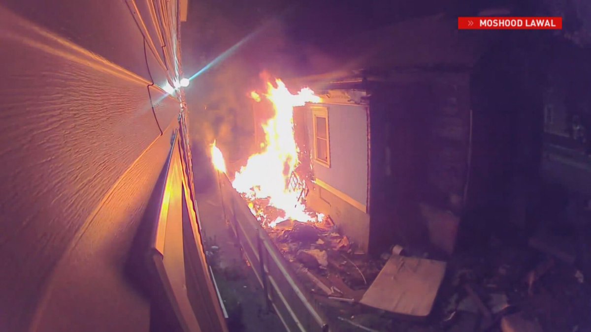surveillance video shows the moments before two homes in Providence caught fire